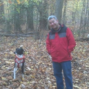 Steve and dog, Scout, in the woods
