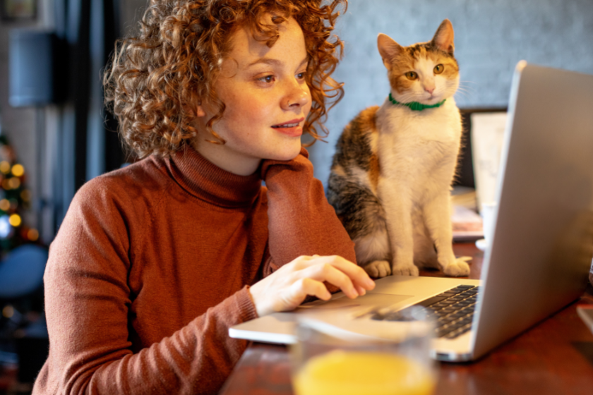 young woman with cat using laptop | The Beginner's Guide to Alt Text