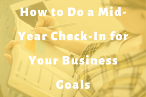 woman writing in a planner slide | How to Do a Mid-Year Check-in for Your Business Goals