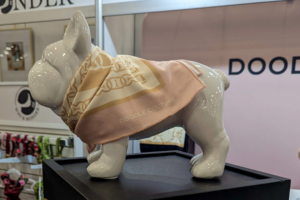 dog figure wearing a light pink bandana | Introducing the BlogPaws Best Award Winners at SuperZoo 2023