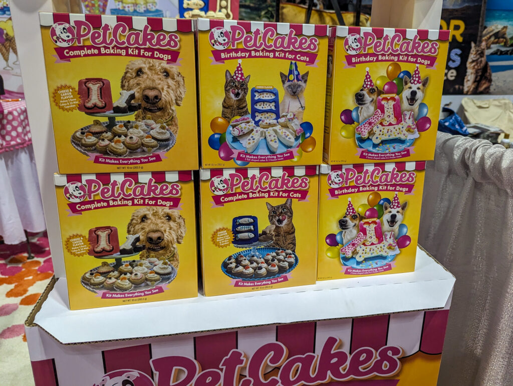 A stack of PetCakes Birthday Baking Kits for Cats and Dogs