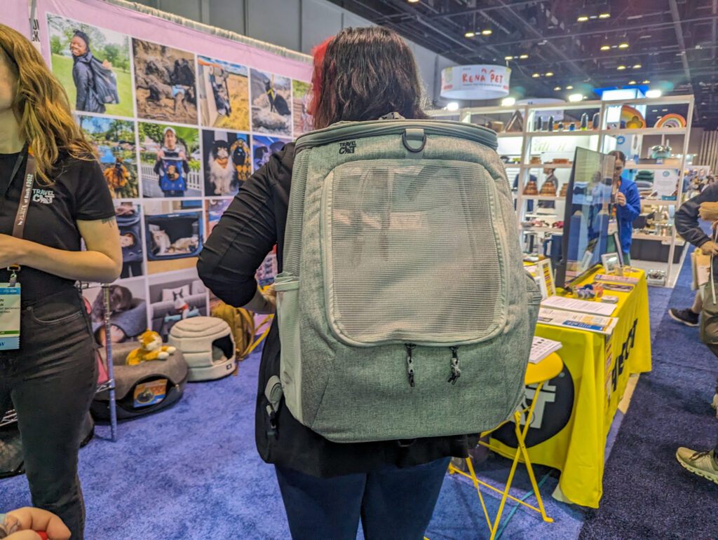 Britt from Team BlogPaws modeling the Navigator Convertible Cat Backpack in gray