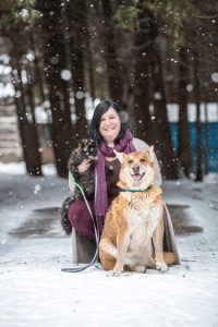 Britt Kascjak with cat and dog in the snow