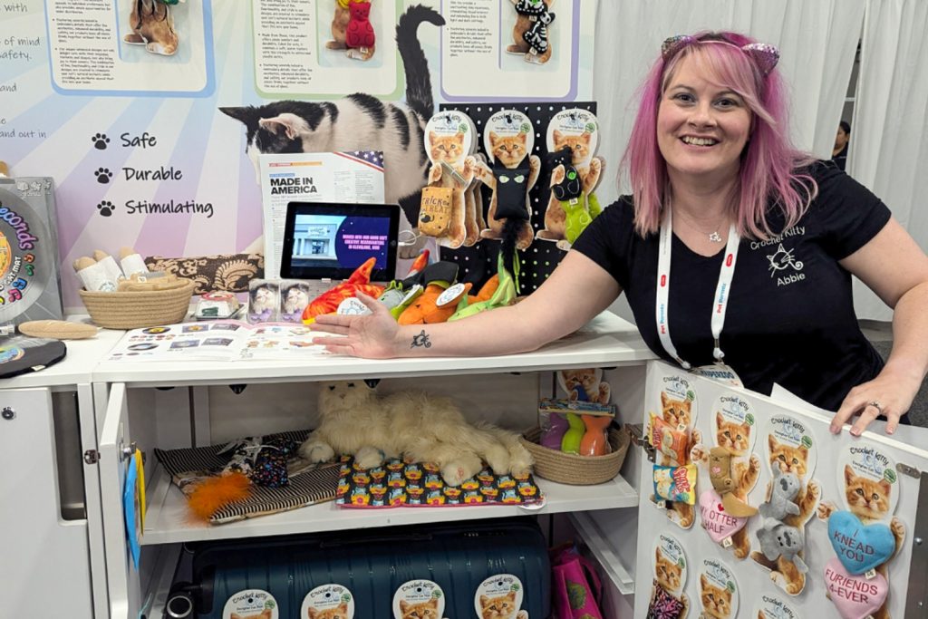 Abbie, Founder of Crochet Kitty, with her SuperZoo 2024 booth 