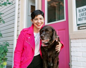 Tori Mistick with her dog wearing pink